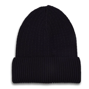 Close-up of the black ribbed knit texture and wide folded cuff on a warm beanie
