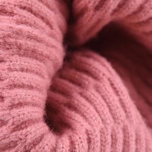 Pink ribbed knit beanie hat for men and women featuring warm soft wool texture