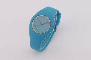 Detailed close-up of blue Geneva quartz watch with silicone strap and red dial markers