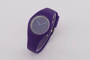 Detail view of purple Geneva quartz watch with silicone strap and blue dial accents