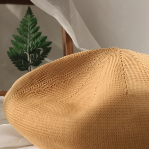 Breathable knit beret hat in light brown featuring a hollow-out pattern for women