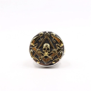 Detailed close-up of a two-tone Masonic skull ring for men with vintage steel engraving