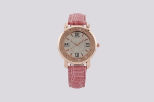 Detail of pink croc-embossed leather strap and rose gold bezel with floating crystals