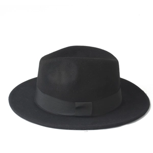 Close-up of classic black fedora wool hat featuring a matching ribbed ribbon band detail