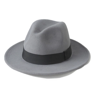 Close-up of a grey wool jazz fedora hat with a black decorative ribbon and buckle