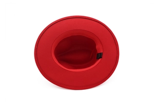 Detail of the inner lining and fabric label on the red flat brim jazz fedora hat
