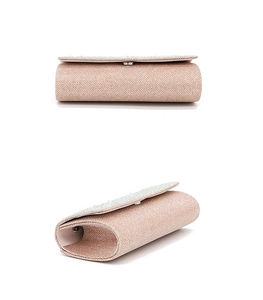 Macro detail of champagne gold evening clutch bag with sparkling rhinestone texture