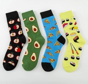 Detail of colorful cotton crew socks featuring pizza, sushi, avocado, and apple patterns