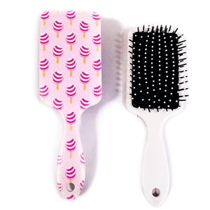 Detail of pink ice cream pattern and black bristles on plastic air cushion brushes