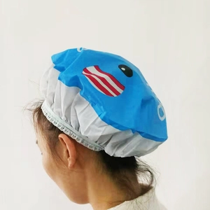 Rear side view of blue and white cartoon shower cap with waterproof elastic band