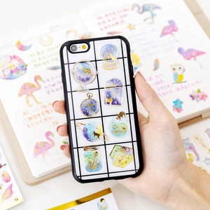 Gilded crystal epoxy stickers featuring golden cats and stars on a phone case