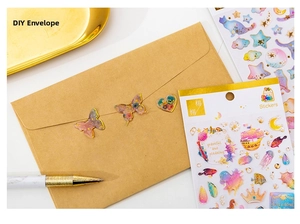 Detail of dreamlike gilded crystal epoxy stickers with butterfly and heart DIY motifs