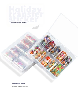 Detail of 20 rolls of Halloween and Christmas nail art foil stickers in clear storage boxes