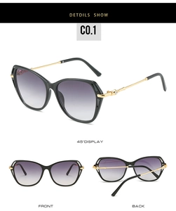 Vue détaillée de lunettes de soleil œil de chat noires avec branches dorées et décor en cristal