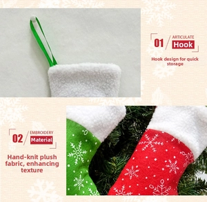 Detail of Christmas stocking hanging loop and white snowflake pattern on fleece fabric