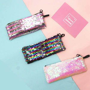 Three sequin pencil cases in silver pink, rainbow, and gradient colors with reversible scales