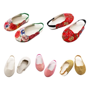 Assorted 18-inch doll shoes featuring floral prints, plain white, and glittery finishes