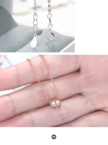 Detail shot of rose gold S925 sterling silver necklace featuring an elegant waist pendant