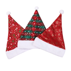 Detailed view of three plush Christmas hats featuring snowflake and red-green plaid patterns