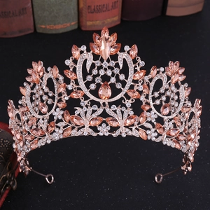 Close-up of rose gold baroque bridal crown with orange gemstones and crystals