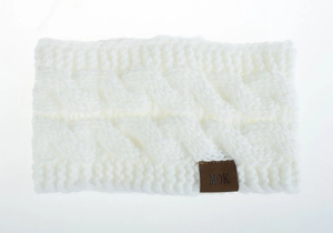 Detailed macro of white cable knit headband with MOK leather label for winter warmth
