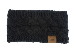 Detail view of thick black cable knit headband with a brown leather MOK label on a white background