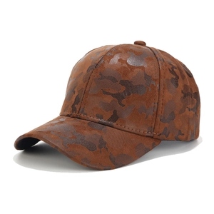 Detailed view of brown camouflage baseball cap in soft faux suede with textured stitching