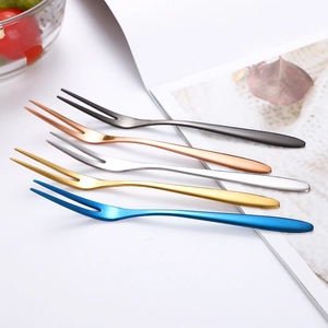 Detailed view of five colorful 304 stainless steel two-prong fruit forks for desserts