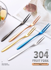 Set of 304 stainless steel two-tine fruit forks in five metallic colors on a table