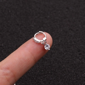 Detailed macro view of S925 silver hoop earring with sparkling round zircon pendant
