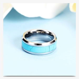 Macro detail of 8mm stainless steel ring featuring a natural turquoise stone inlay