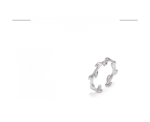 Detailed view of silver olive branch leaf ring with adjustable open design in copper