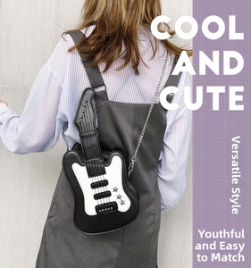 Detail of creative guitar-shaped crossbody bag with silver stars and chain strap