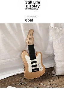 Close-up of gold guitar-shaped crossbody bag with star details and metal chain on white bed