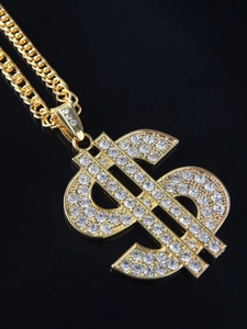 Macro shot of 18K gold plated hip-hop dollar sign pendant with sparkling crystal rhinestones