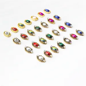 Flatback oval nail art charms with vintage gold alloy settings and colorful gemstones