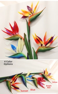Detail view of artificial bird of paradise flowers in yellow, red, blue, and sunset colors