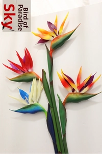 Close-up of artificial bird of paradise flowers with realistic petals and green stems