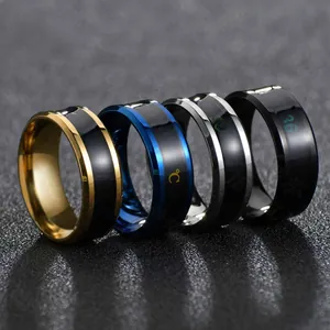 Macro view of men's temperature sensitive rings in gold, blue, silver and black colors