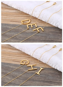 Detail of gold letter pendants D to I on delicate stainless steel chains for women