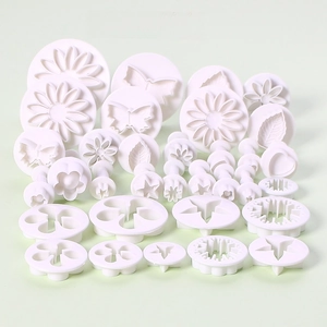 33-piece white plastic fondant plunger cutters set with 10 floral and star patterns