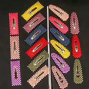 Colorful beaded hair clips in various shapes and pastel colors for women hair styling