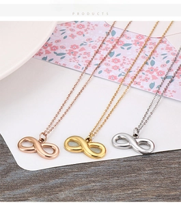 Detailed display of three infinity symbol necklaces in rose gold, gold and silver finishes