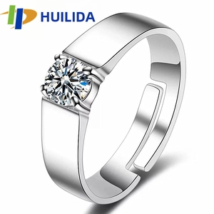 Macro shot of silver adjustable men's ring with large round-cut zircon and open band