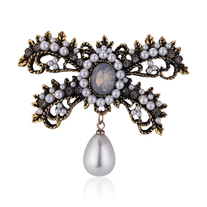 Vintage bronze brooch with white pearls, dark crystals, and a water drop pearl pendant
