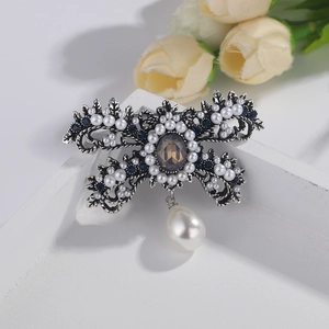 Silver vintage brooch with pearls, blue crystals and brown gemstone for women