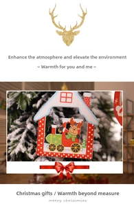 Detailed view of a wooden house-shaped Christmas ornament with reindeer and train patterns