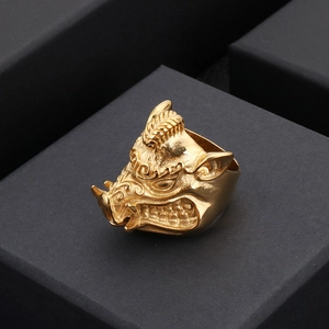 Gothic gold stainless steel wild boar head ring for men on a black matte jewelry box