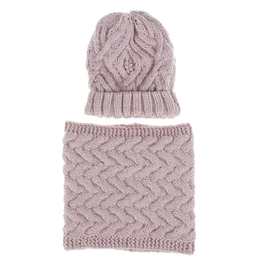 Detail of dusty pink cable knit beanie and infinity scarf set on white background