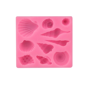 Pink silicone mold featuring nine distinct seashell and conch shapes for fondant or chocolate